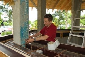 Forming gazebo man placing rebar in gazebo before casting concrete countertop