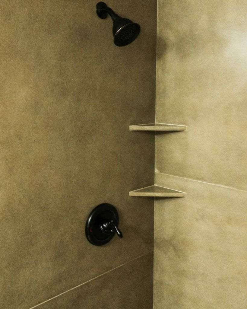 concrete shower panels and integrated shelves closeup